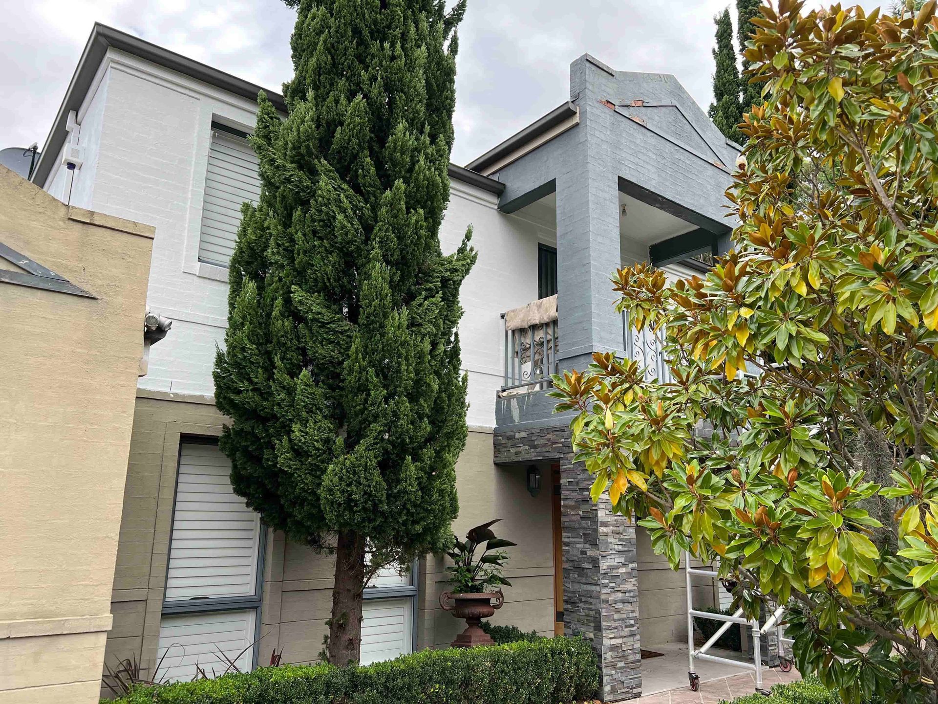 A large house with a lot of trees in front of it — D & J Saverino Painting & Decorating Pty Ltd In Fairy Meadow, NSW