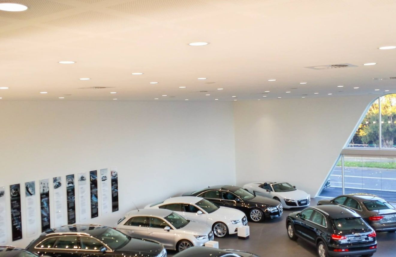 A Lot of Cars Are Lined Up in a Showroom — D & J Saverino Painting & Decorating Pty Ltd In Fairy Meadow, NSW