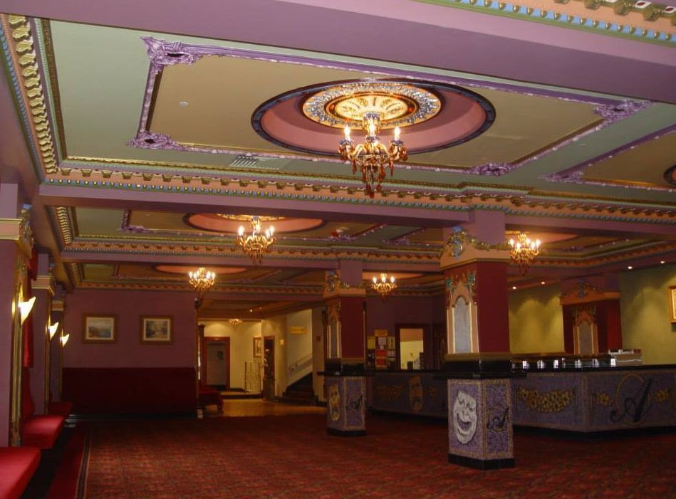 A Large Lobby With a Chandelier Hanging From the Ceiling — D & J Saverino Painting & Decorating Pty Ltd In Fairy Meadow, NSW