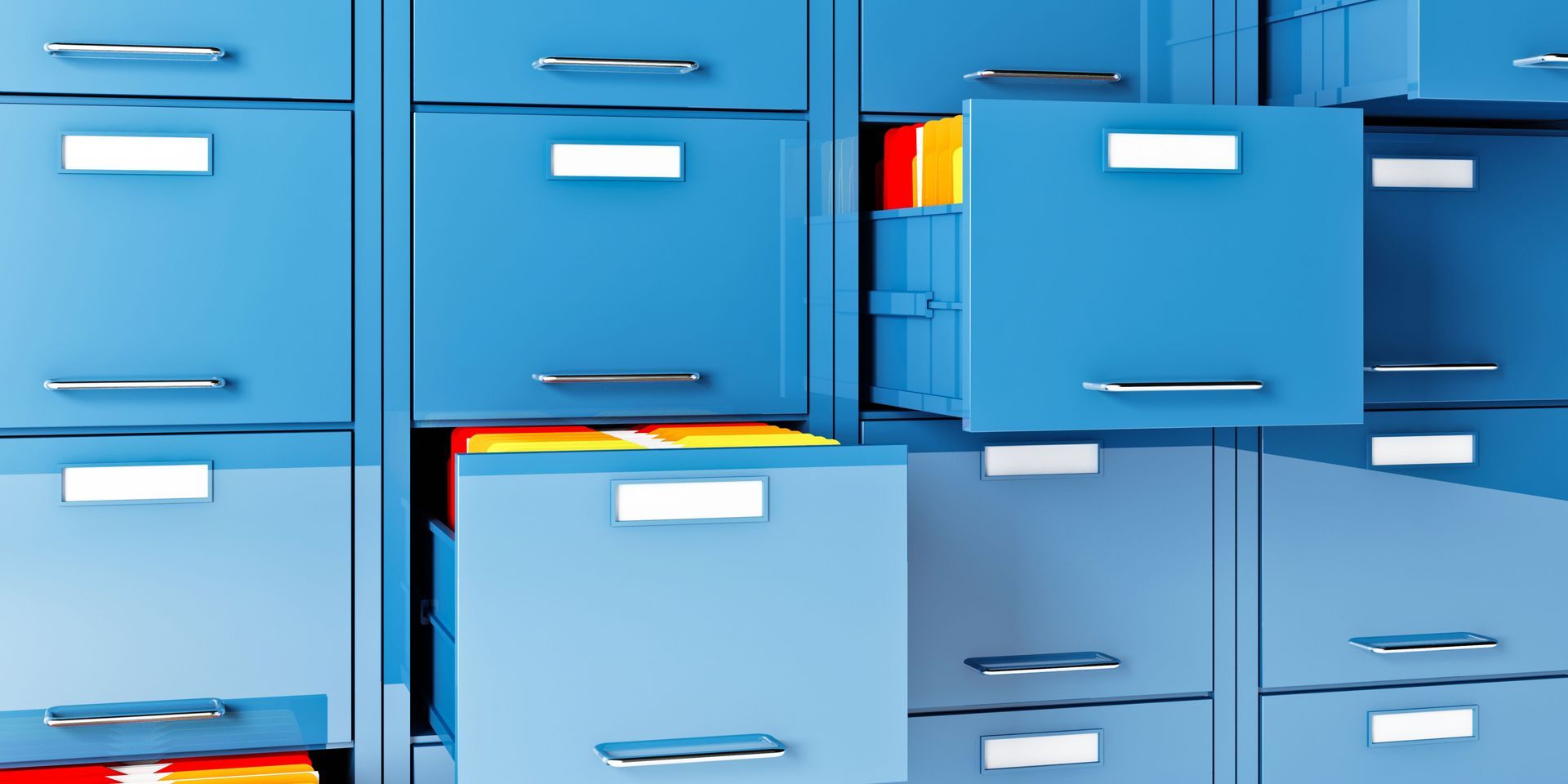 Blue file cabinets with several drawers open, revealing colorful file folders.