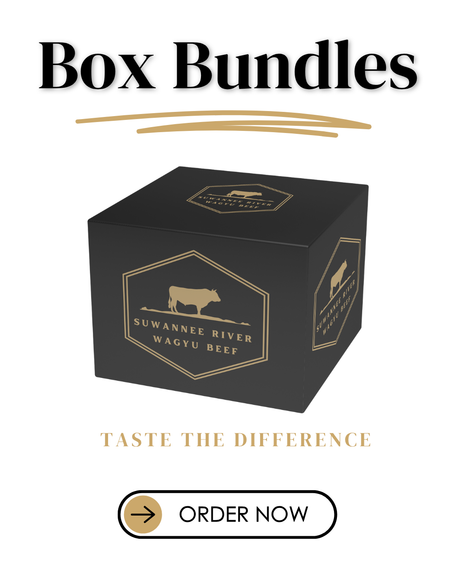 A box of meat is sitting on top of a lush green field.