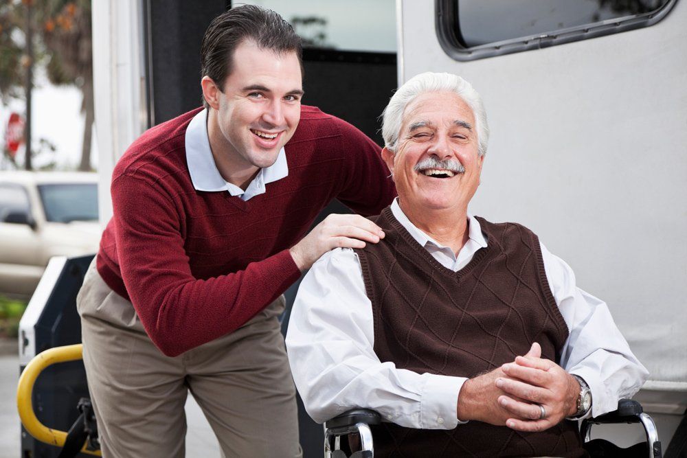 Smiling Man And Senior Citizen — Irving, TX — Elite Care Transports