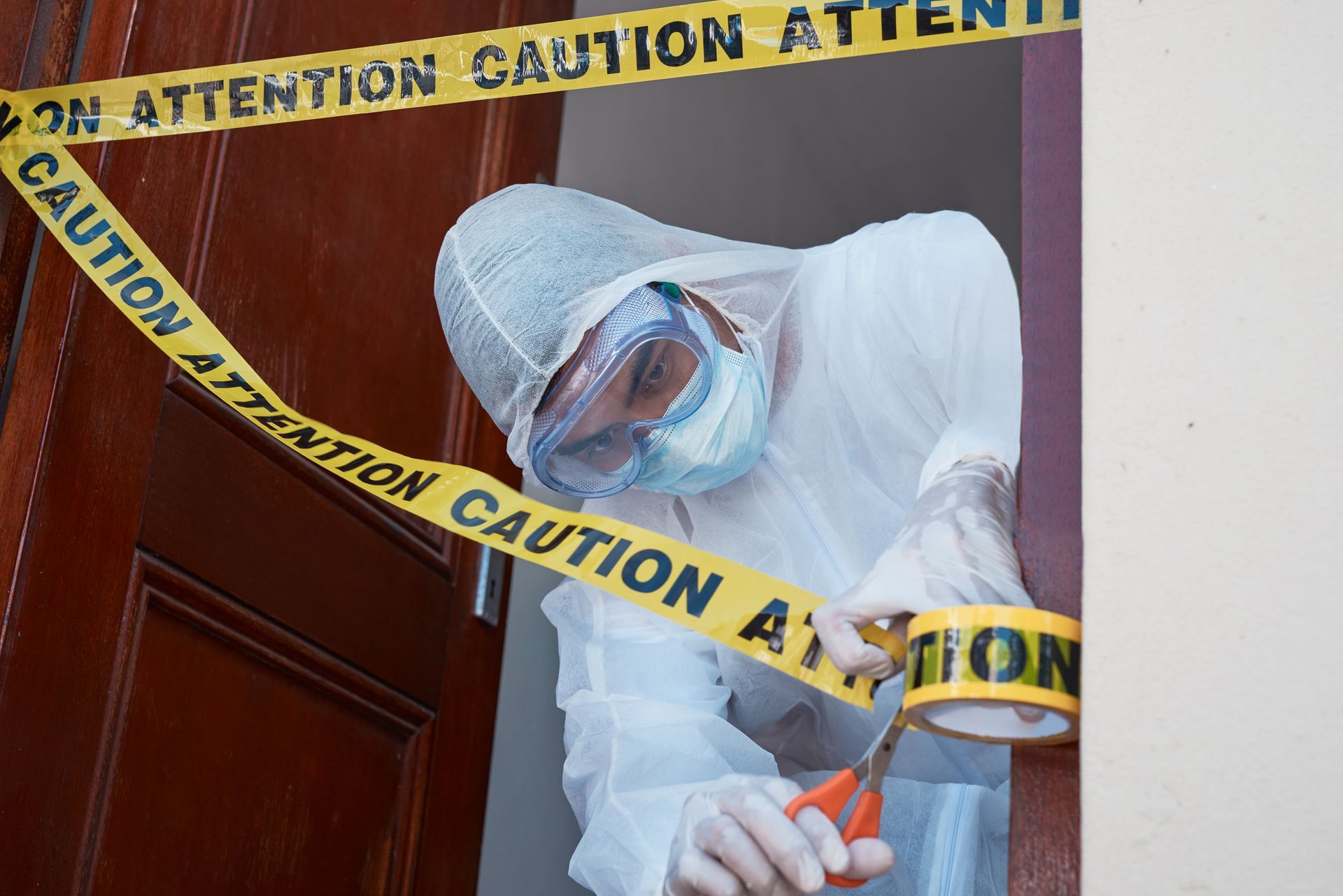 Man Putting Crime Tape — Southwest, FL — ProRemedy SWFL Man Putting Crime Tape — Southwest, FL — ProRemedy SWFL