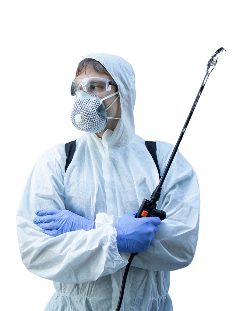 A man in a protective suit and mask is holding a sprayer.