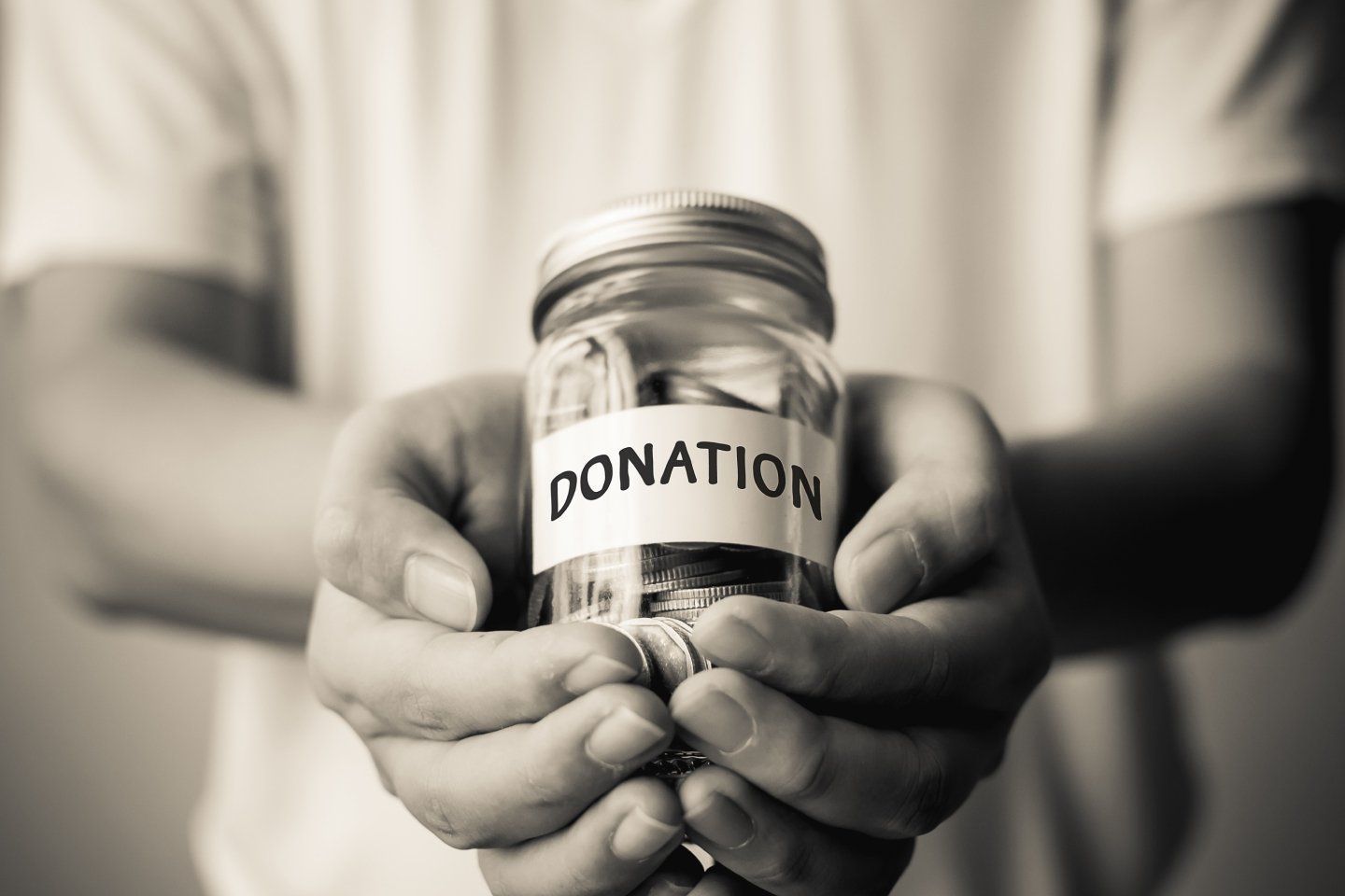 Man Holding Donation Jar