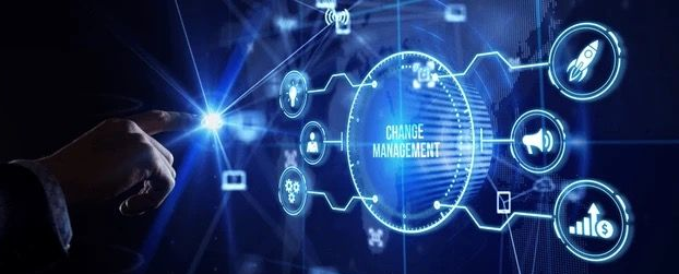 Stack of white papers bound together with a black rubber band.