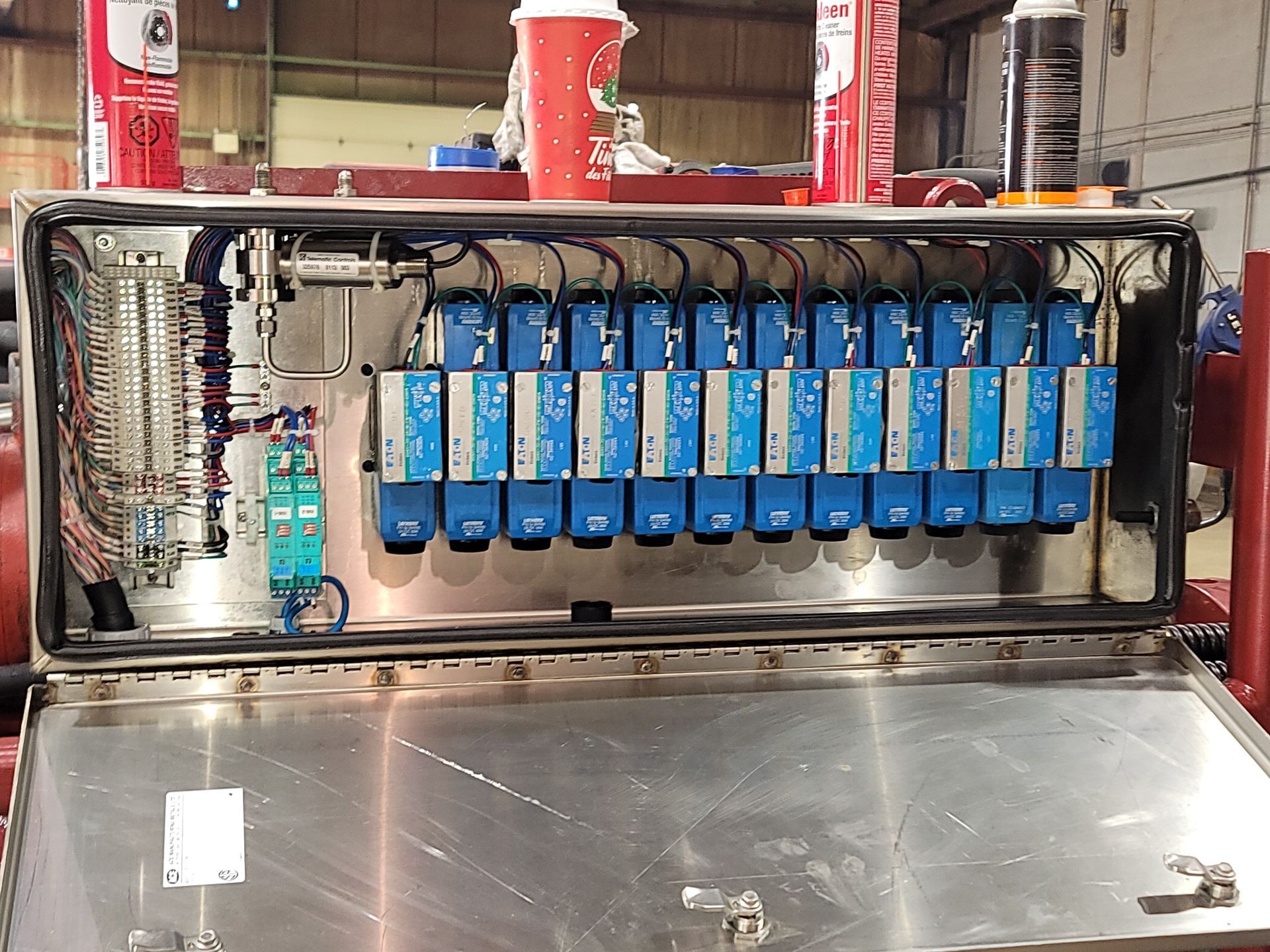 A stainless steel box with a bunch of electrical equipment inside of it