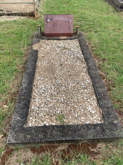 A Grave In A Cemetery With A Gravestone And Gravel — Northern Rivers Headstones in Casino NSW