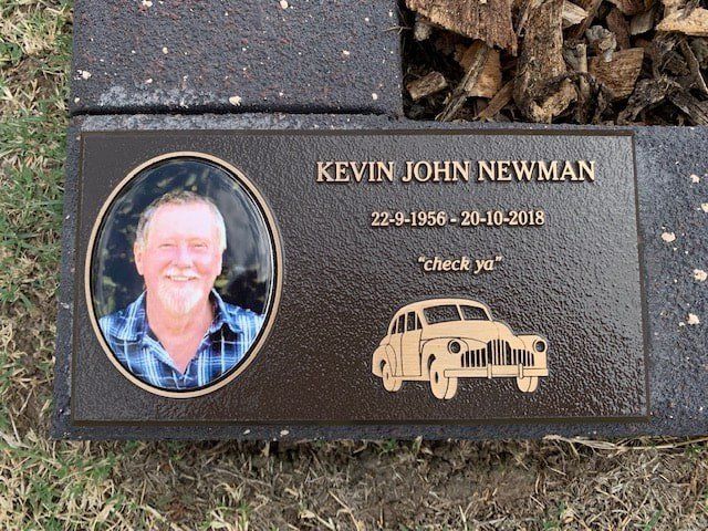 A Gravestone with A Picture of A Man and A Car on It — Northern Rivers Headstones in Casino, NSW