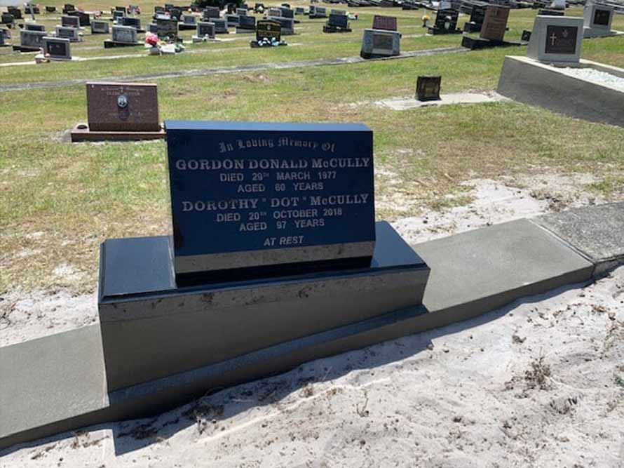 A Black Gravestone In A Cemetery With The Name Gordon On It — Northern Rivers Headstones in Casino NSW
