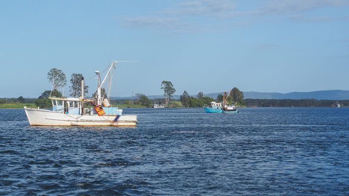 A Boat Is Floating On The Ocean — Northern Rivers Headstones in Maclean, NSW