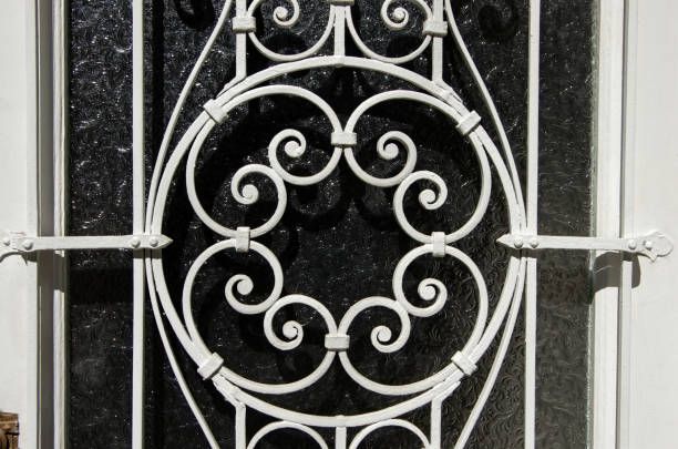 Decorative metal storm doors with frosted glass offer secure, elegant front door protection