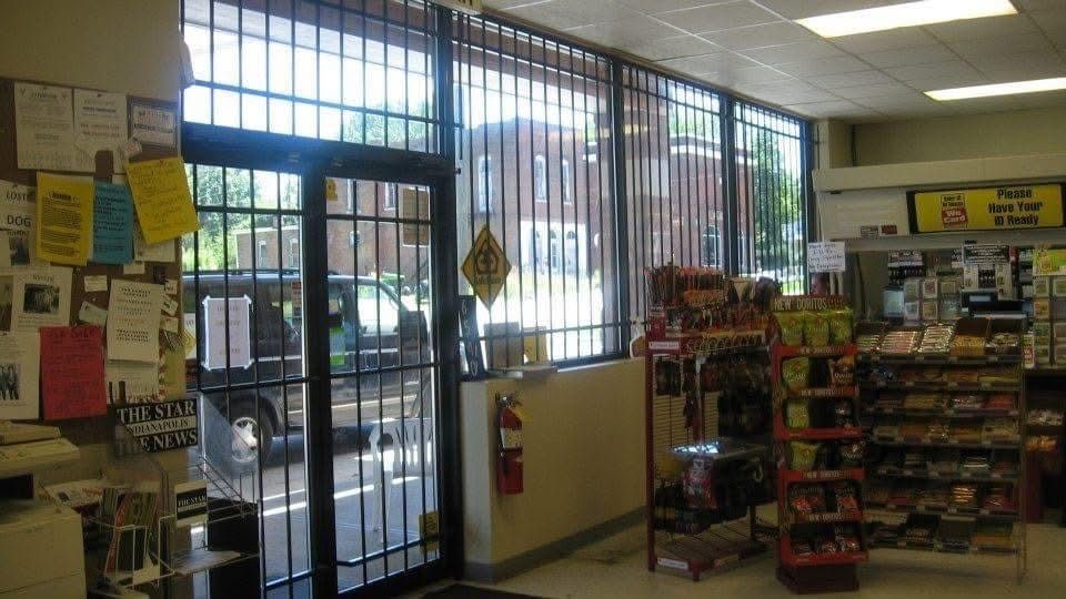 Man Repairing The Doorknob - Indianapolis, IN - Markin Sales Camper & Security Doors