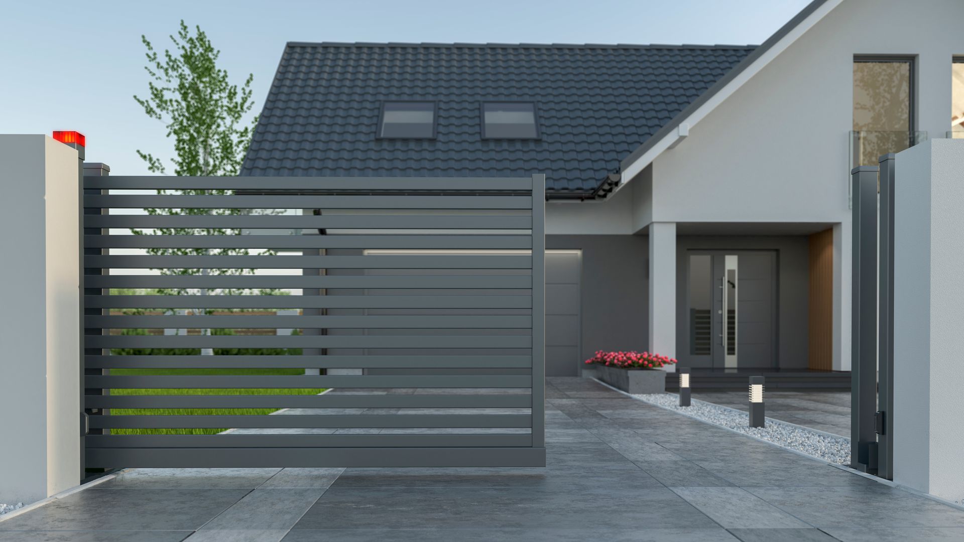 A modern house with a sliding gate in front of it.