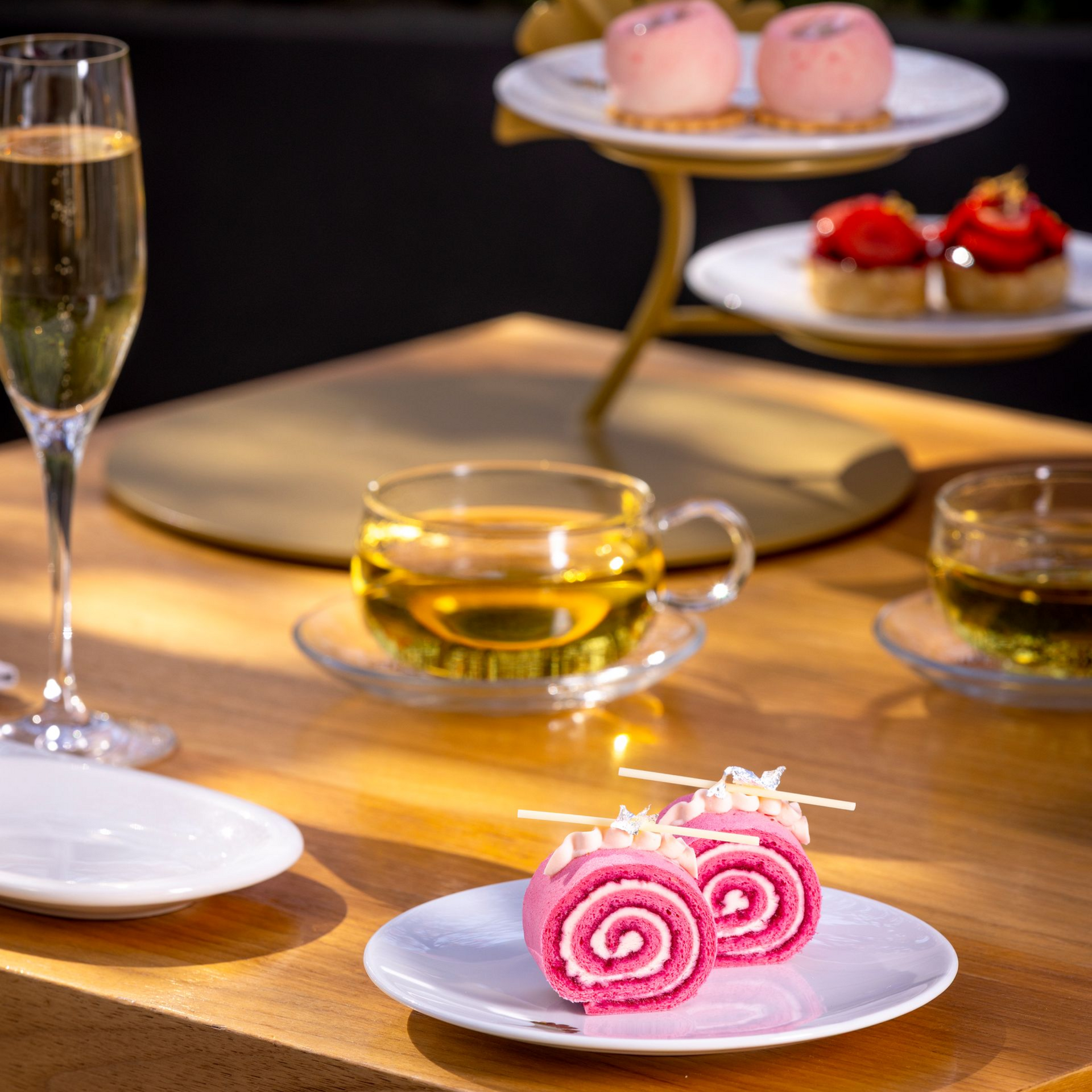 Zen garden with sand, large rocks, and wooden blinds in the background.