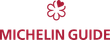 Michelin Guide logo: red flower symbol with heart shape, below