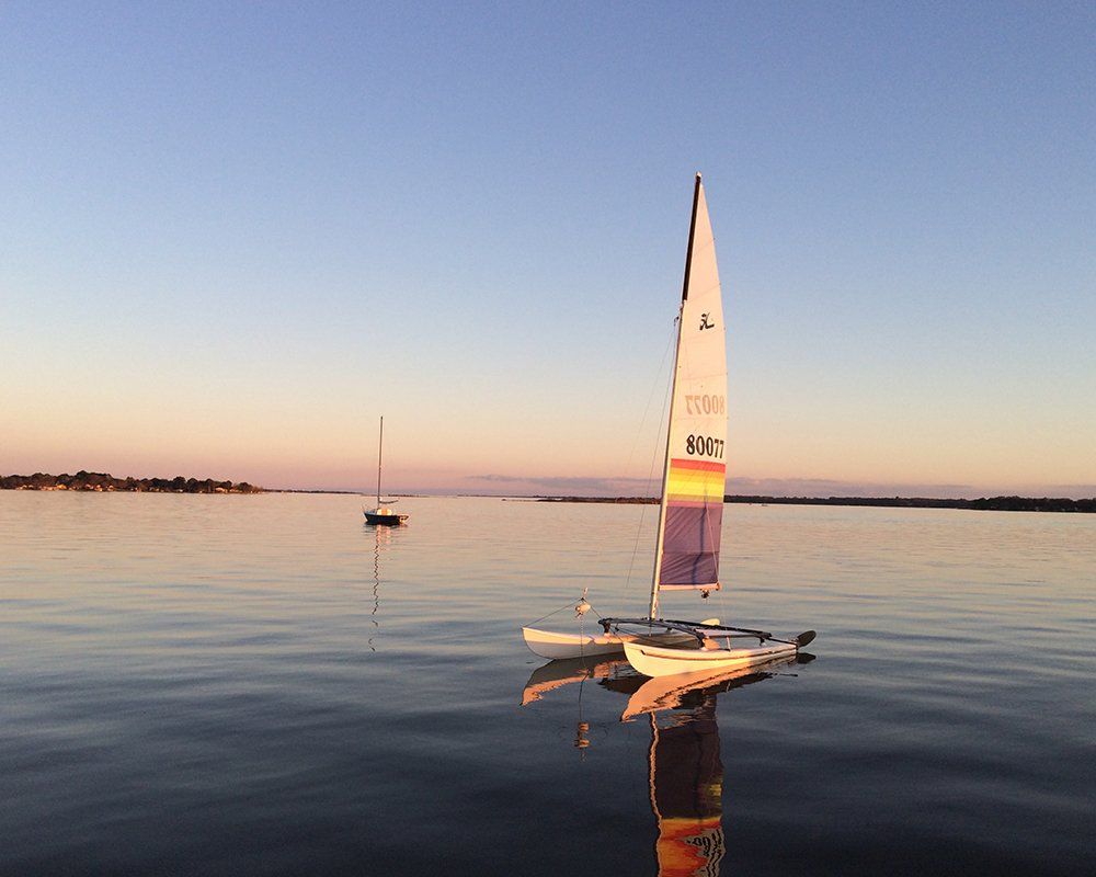 A small sailboat on a calm Texas lake