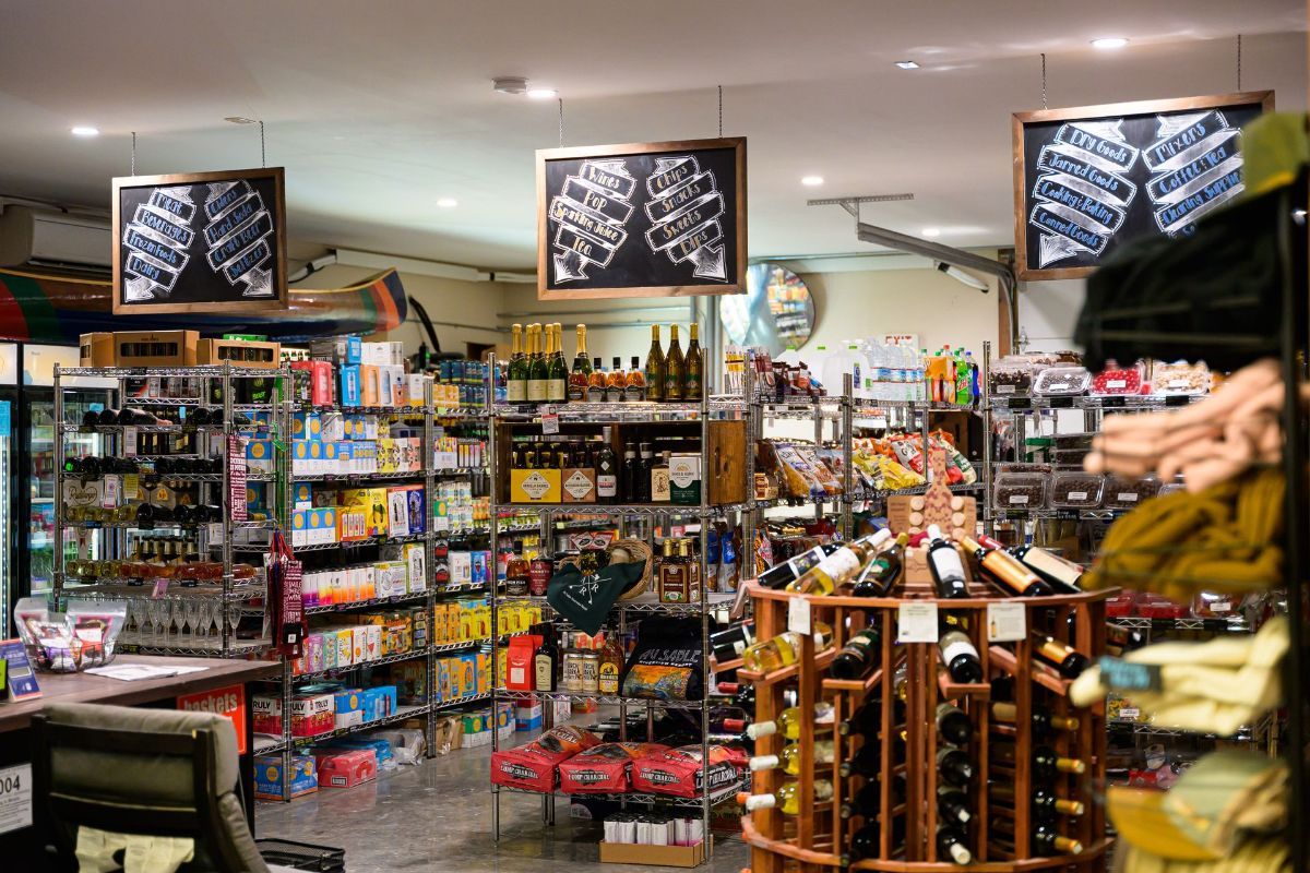 A grocery store filled with lots of bottles of wine.