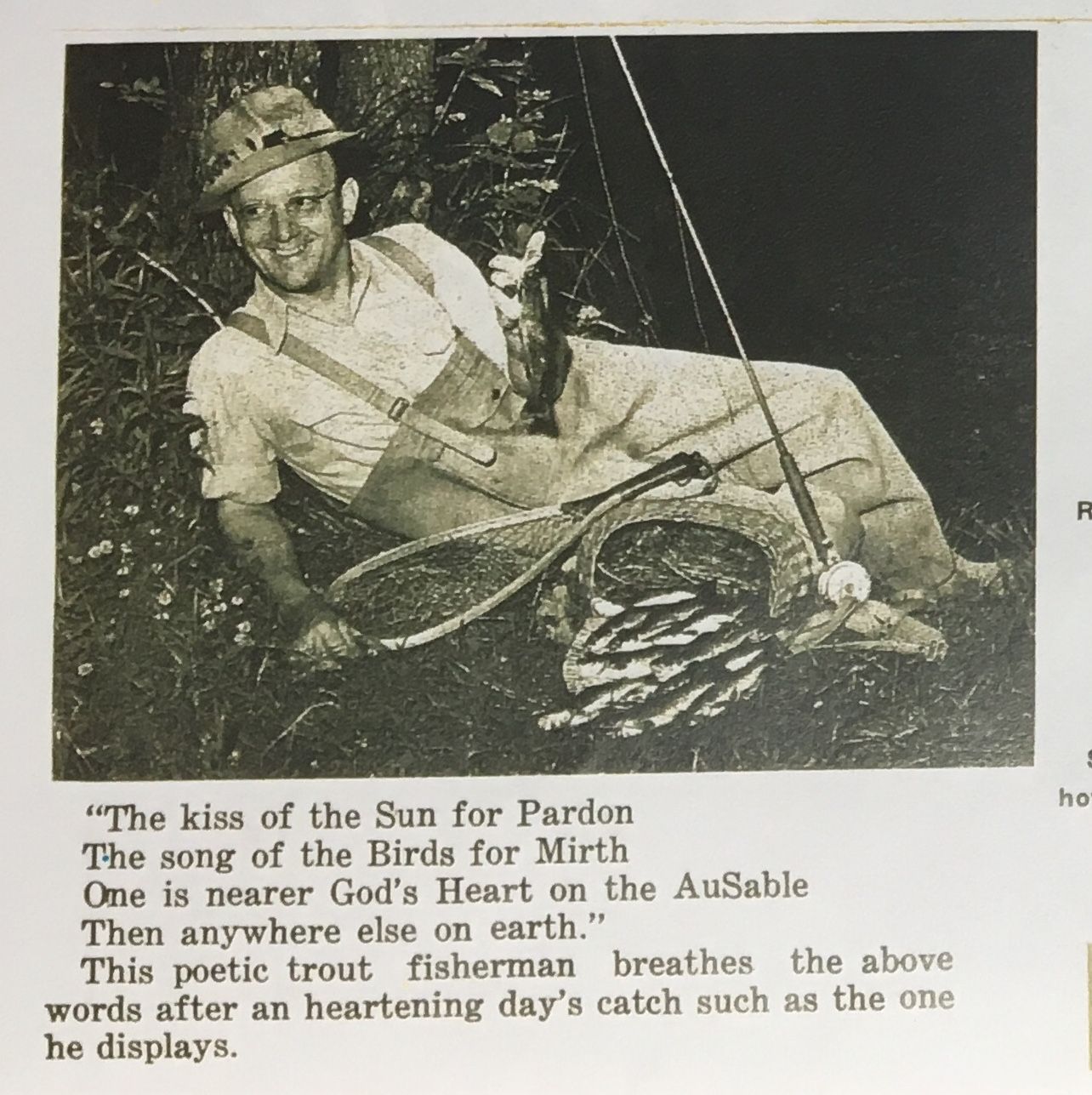 A black and white photo of a man with a fishing rod