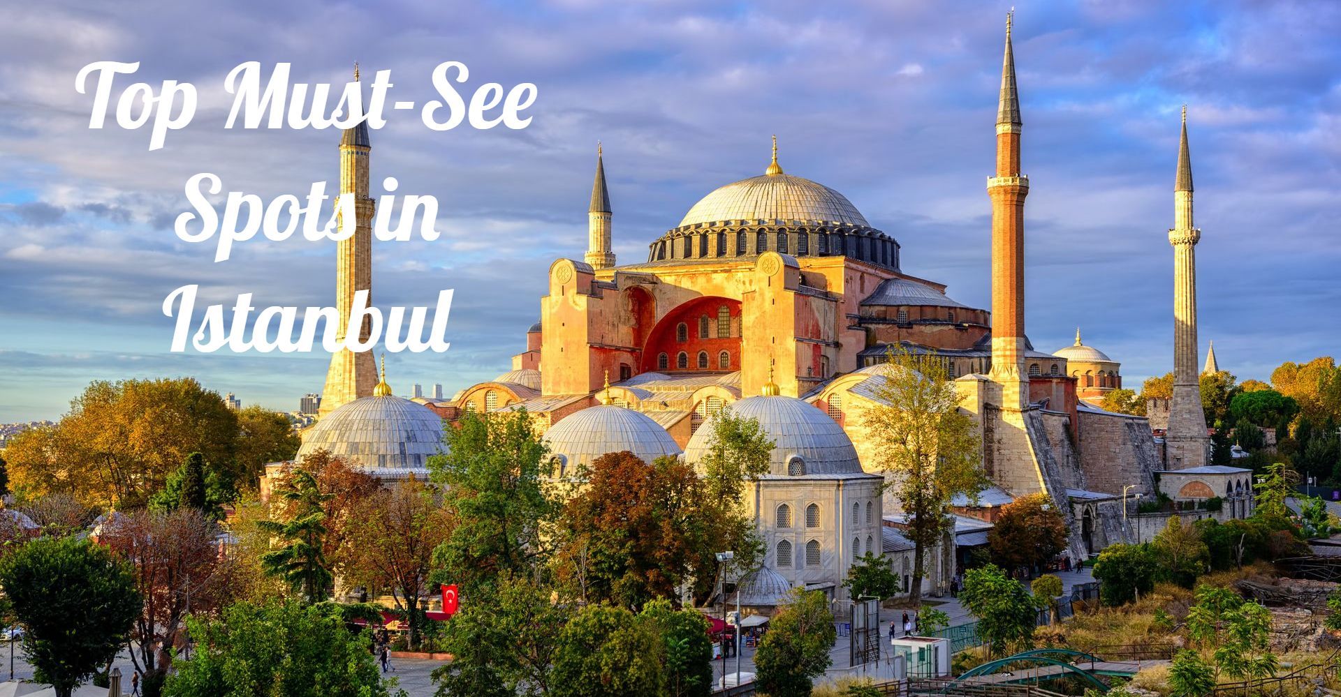 Exterior view of Hagia Sophia in Istanbul with its grand domes and minarets under a blue sky