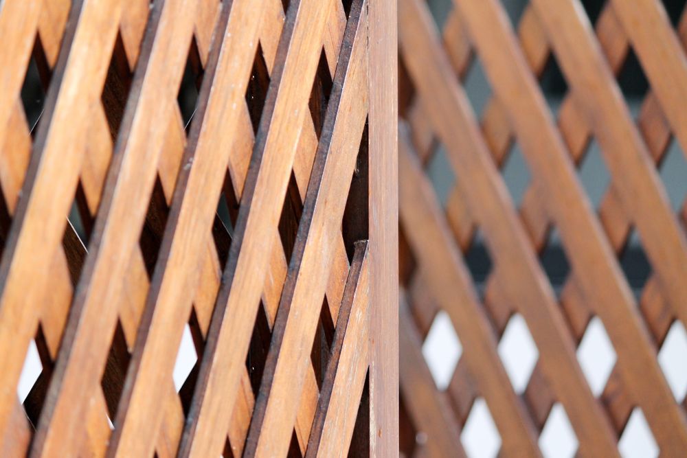A Close Up Of A Wooden Lattice Fence — Ulladulla Blinds & Home Improvements In Ulladulla, NSW
