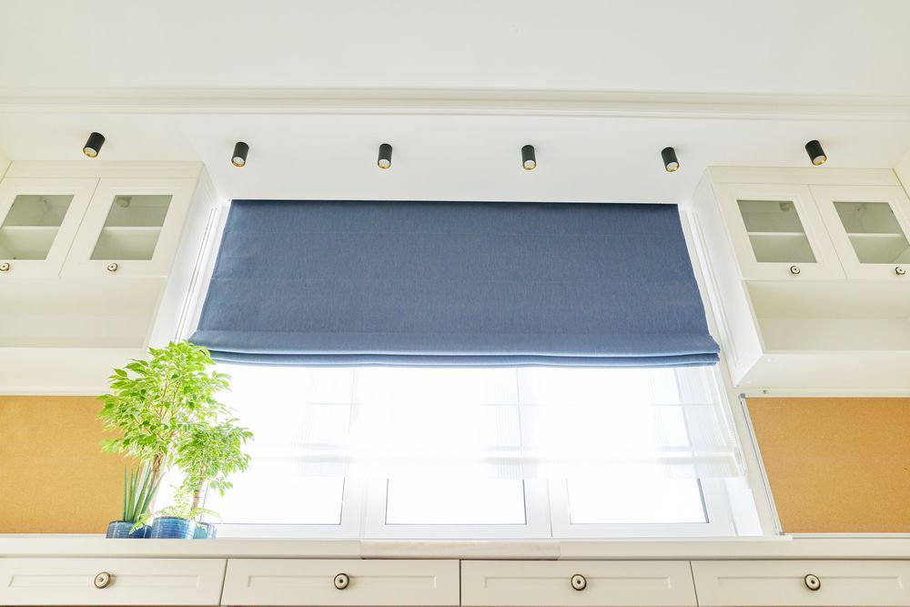 Blue Roman Shade Adds Privacy And Style To Kitchen Window — Ulladulla Blinds & Home Improvements In Ulladulla, NSW