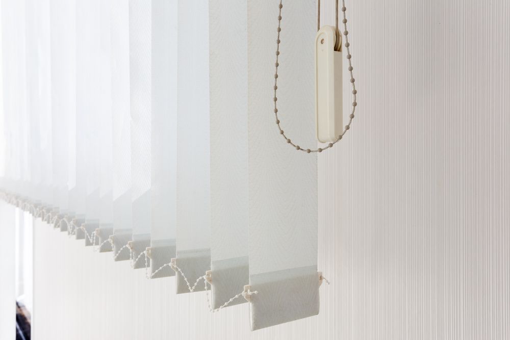 Close-up Of Vertical Blinds With A Pull Chain Detail — Ulladulla Blinds & Home Improvements In Ulladulla, NSW