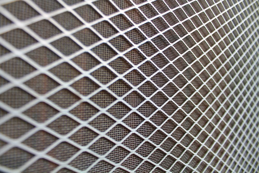 A Close-up Of A Diamond-patterned Metal Mesh. — Ulladulla Blinds & Home Improvements In Ulladulla, NSW