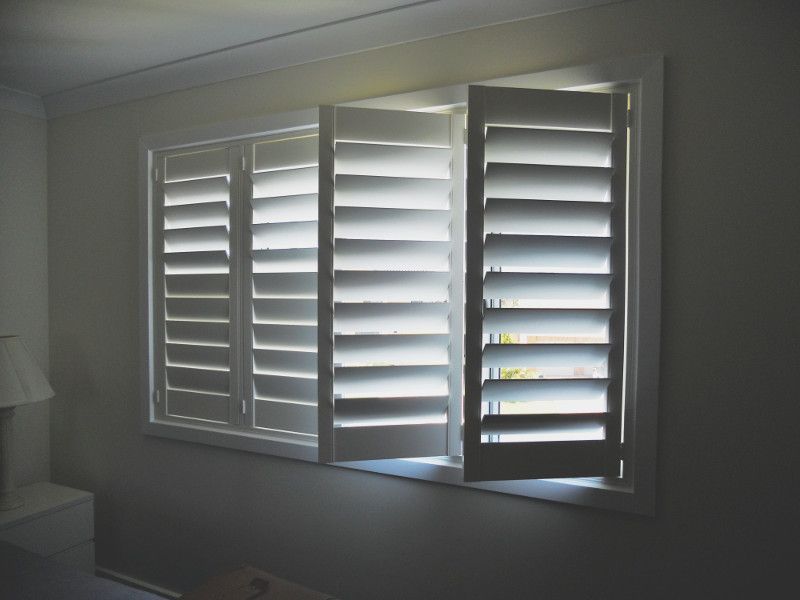 Open White Plantation Shutters On A Window — Ulladulla Blinds & Home Improvements In Ulladulla, NSW