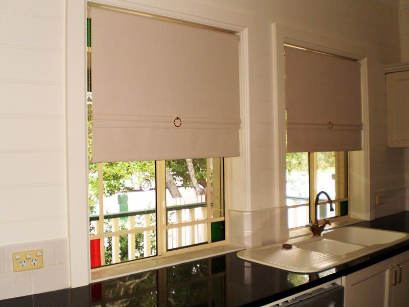 Beige Roller Blinds With Decorative Rings In A Kitchen — Ulladulla Blinds & Home Improvements In Ulladulla, NSW