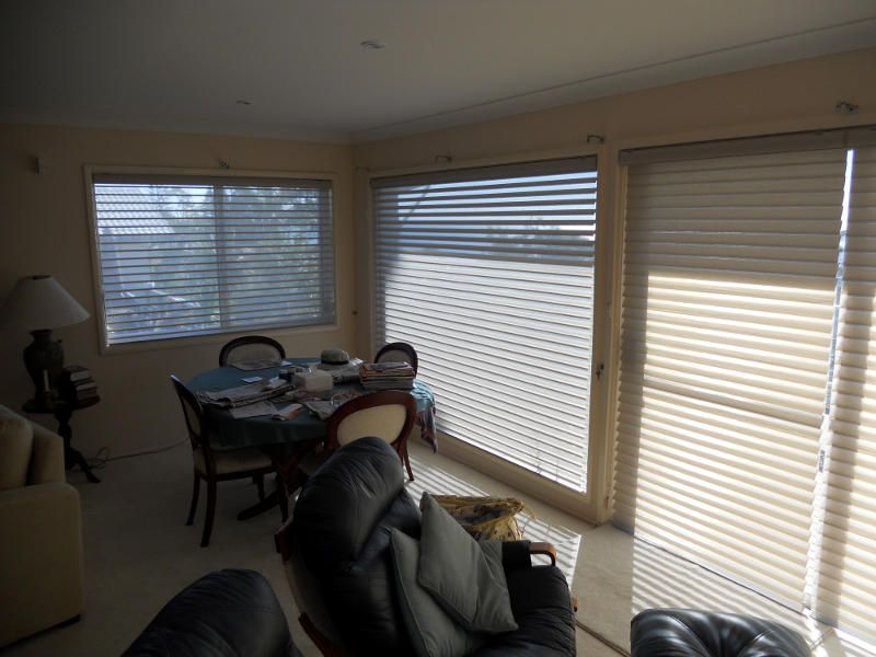 Roller Blinds Providing Privacy And Light Control In A Living Room — Ulladulla Blinds & Home Improvements In Ulladulla, NSW