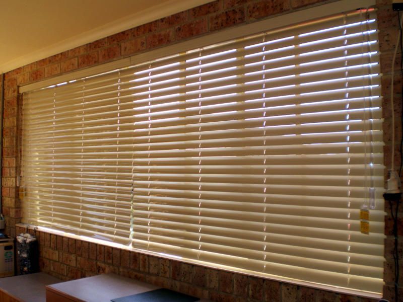 Light Brown Wooden Venetian Blinds, Partially Open — Ulladulla Blinds & Home Improvements In Ulladulla, NSW