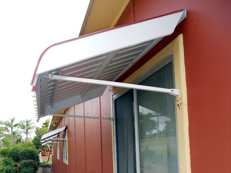 White Window Canopies Enhancing The Curb Appeal Of A Building — Ulladulla Blinds & Home Improvements In Ulladulla, NSW