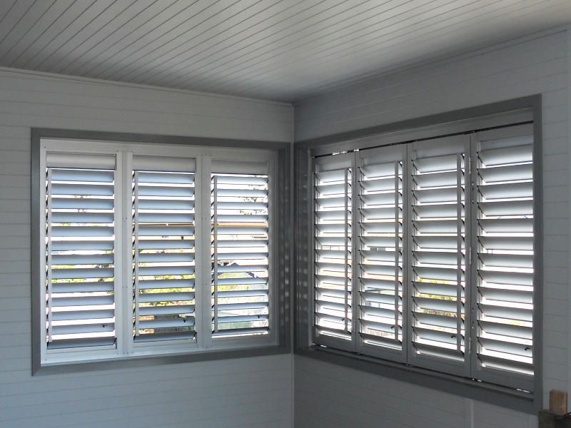 White Plantation Shutters, Closed Position, On A Corner Window — Ulladulla Blinds & Home Improvements In Ulladulla, NSW