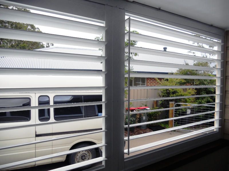 White Plantation Shutters, Partially Open, On A Large Window — Ulladulla Blinds & Home Improvements In Ulladulla, NSW