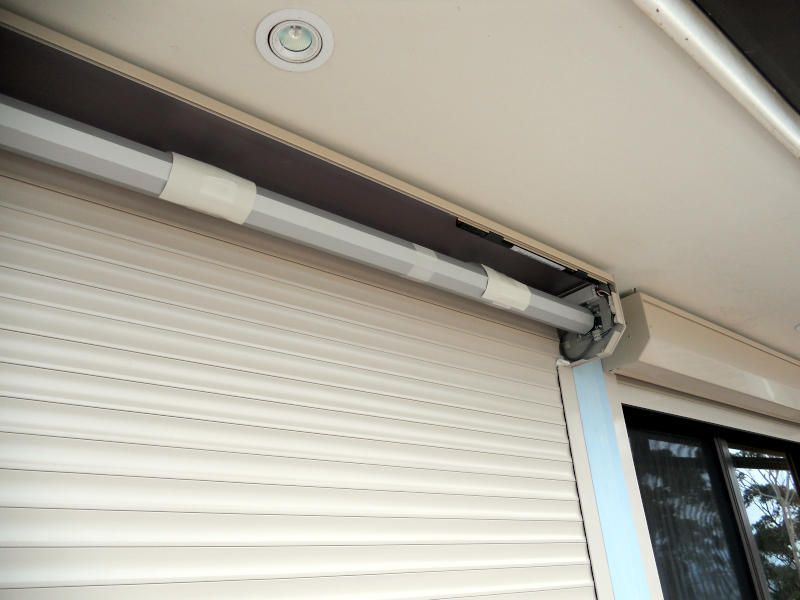 Close-up Of Roller Shutter Mechanism, Showing The Rollers And Guide Rails — Ulladulla Blinds & Home Improvements In Ulladulla, NSW