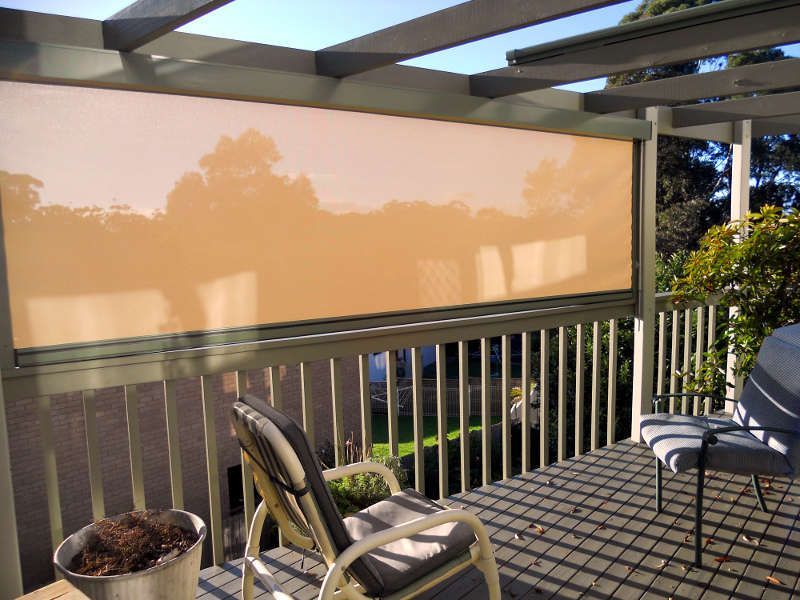Outdoor Roller Blinds Covering A Patio, Offering Shade And Privacy — Ulladulla Blinds & Home Improvements In Ulladulla, NSW