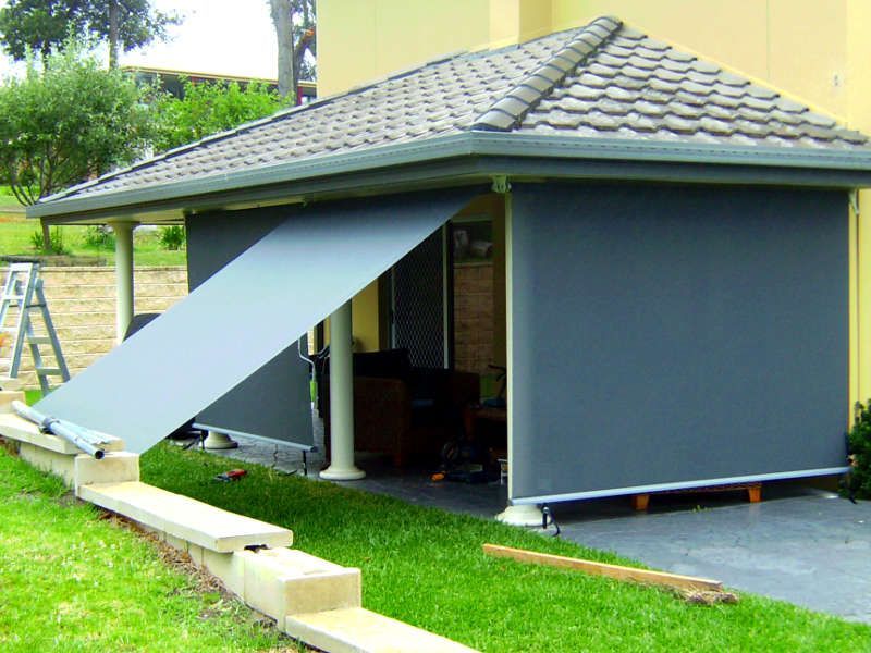 Freestanding Outdoor Roller Blinds, Partially Retracted, Surrounding A Patio — Ulladulla Blinds & Home Improvements In Ulladulla, NSW