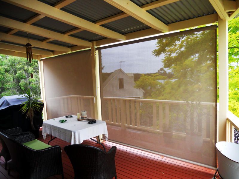 Outdoor Sheer Blinds, Partially Rolled Down, On A Covered Patio — Ulladulla Blinds & Home Improvements In Ulladulla, NSW