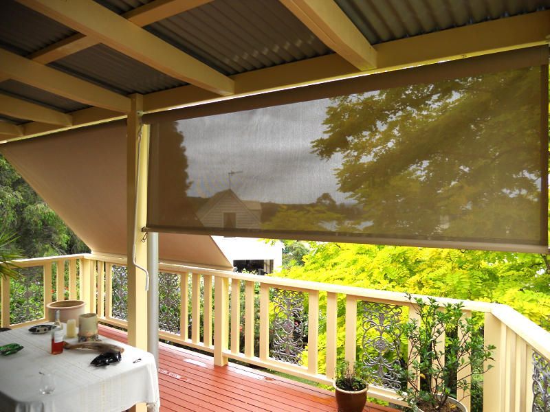 Beige Outdoor Roller Blinds, Partially Rolled Down, On A Deck — Ulladulla Blinds & Home Improvements In Ulladulla, NSW