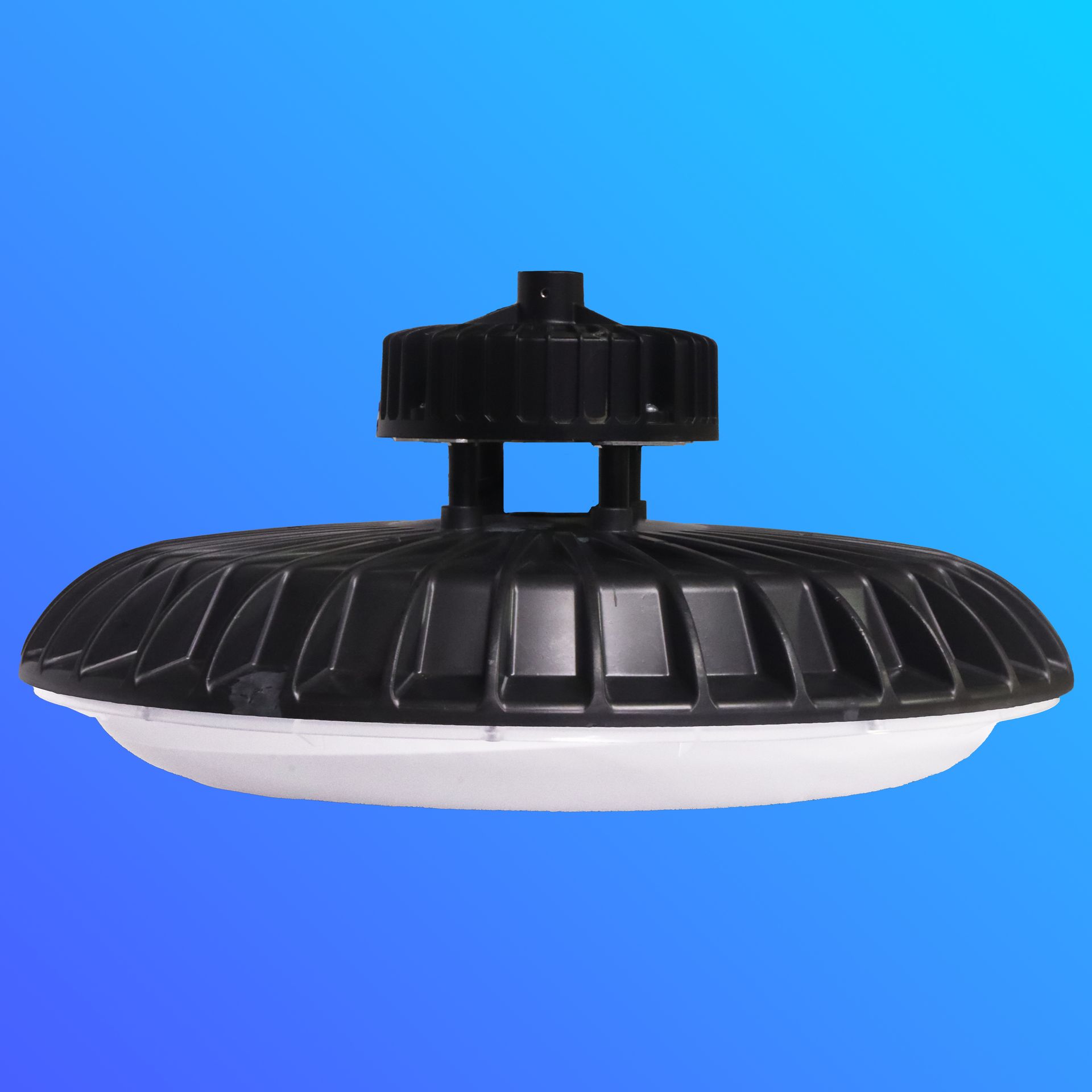 A light that looks like a ufo is against a blue sky