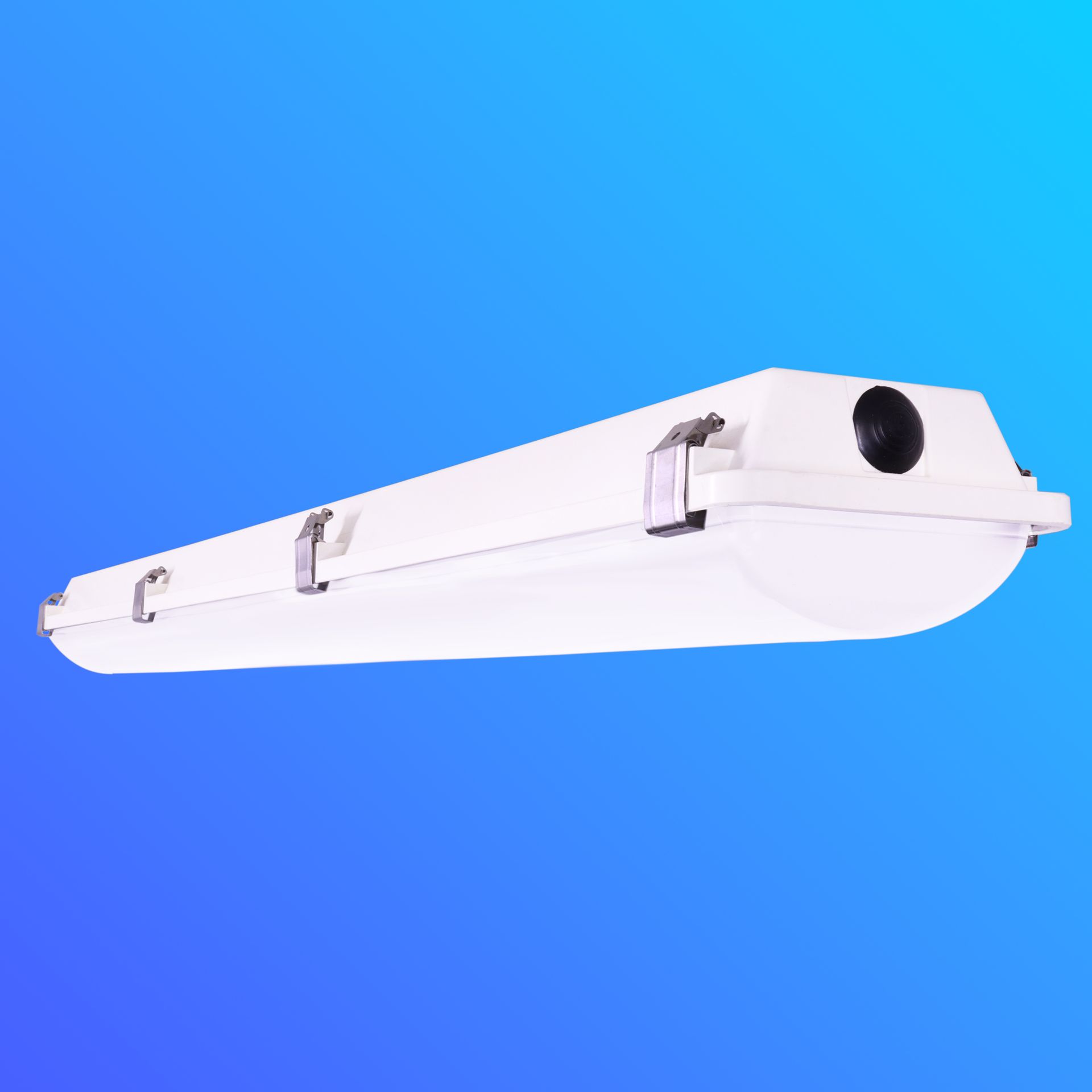 A white light fixture against a blue sky