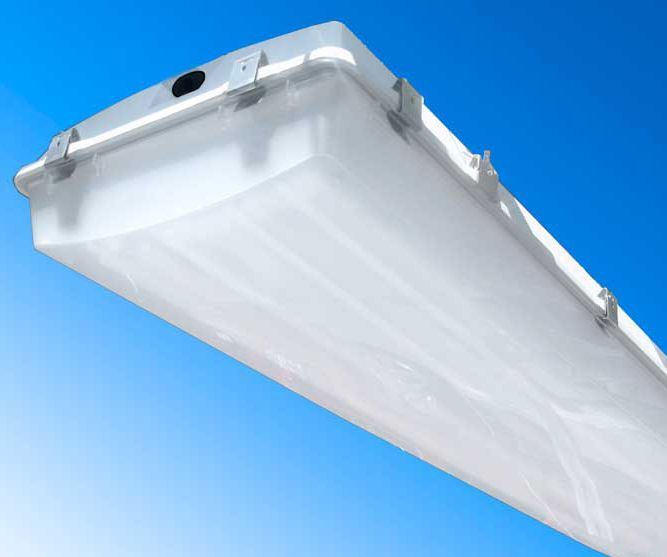 A white light fixture is against a blue sky