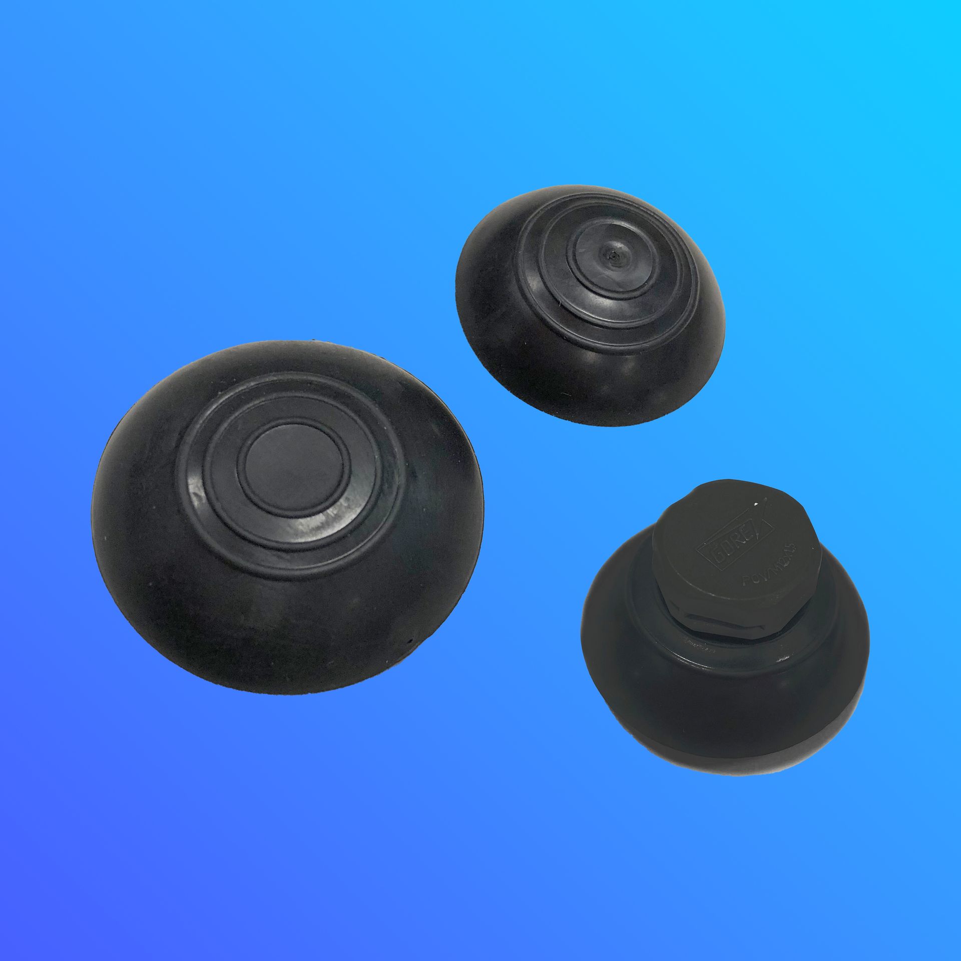 Three black rubber balls on a blue background