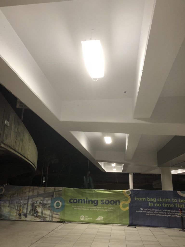 A building under construction with a sign that says `` coming soon ''.