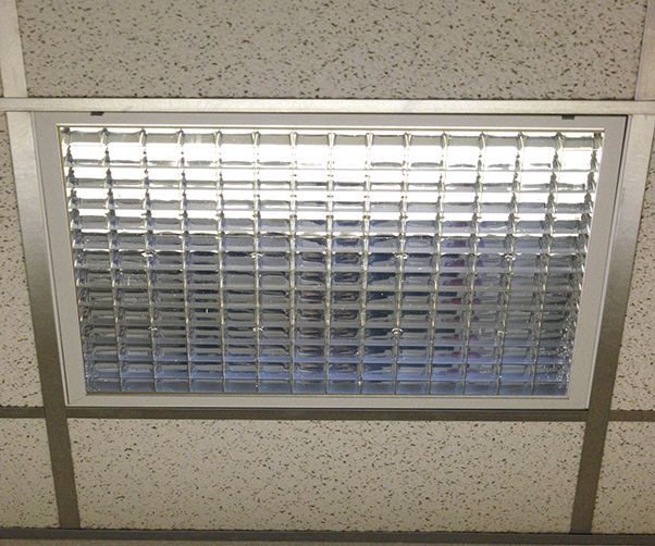 A ceiling with a light on it that looks like a window