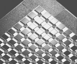 A close up of a metal ceiling with a checkered pattern