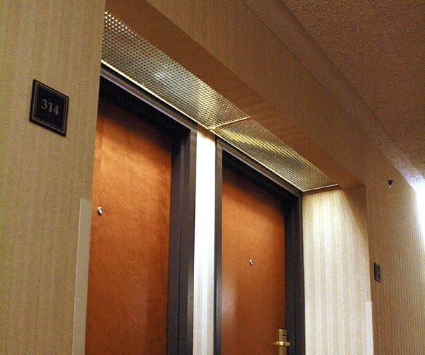 A hallway with a door that has the number 314 on it