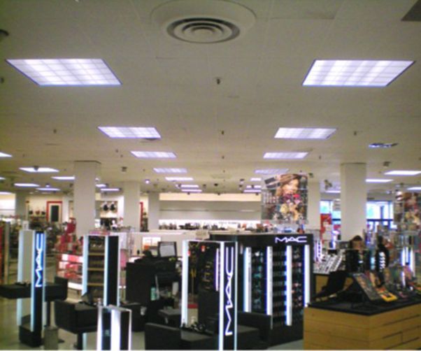 A mac store with a lot of lights on