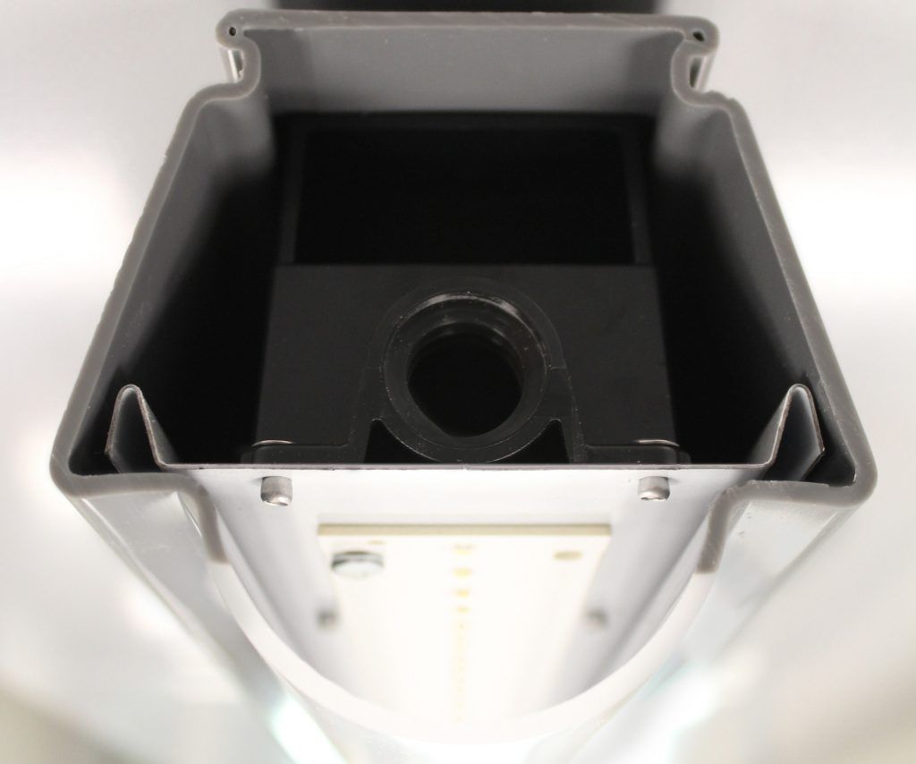 A gray and white item with a hole in the middle